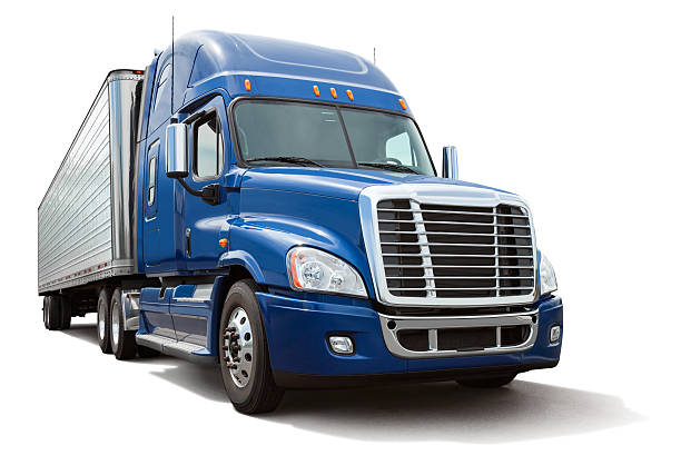 Blue semi truck or 18 wheeler hauling a metal cargo bay isolated on white. Clipping path provided for truck. Canon 5DMarkII. File meticulously cleaned up in Photoshop.